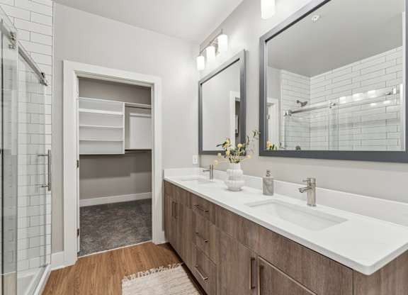 bathroom with view into walk in closet at The Hendry Apartments, Fort Myers, FL