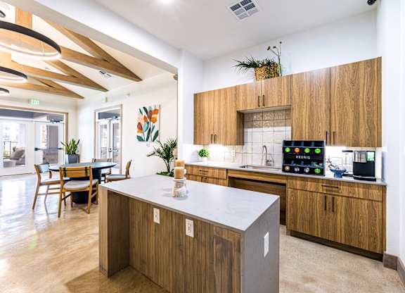 Kitchen with wooden cabinets and a white counter top at The Parker Austin, Pflugerville