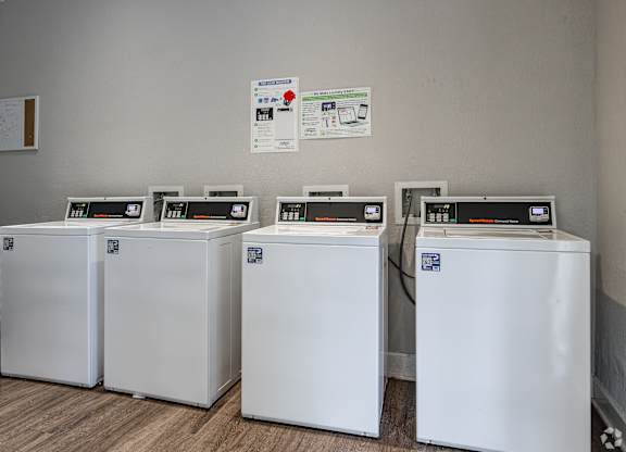 Four White Washing Machines at Avondale Place Apartments, Avondale Estates, GA