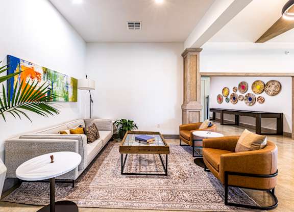 Living room with couches and chairs and a table at The Parker Austin, Texas