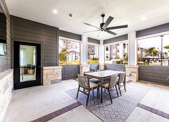 Dining area with a table and chairs and a ceiling fan at The Parker Austin, Pflugerville, Texas