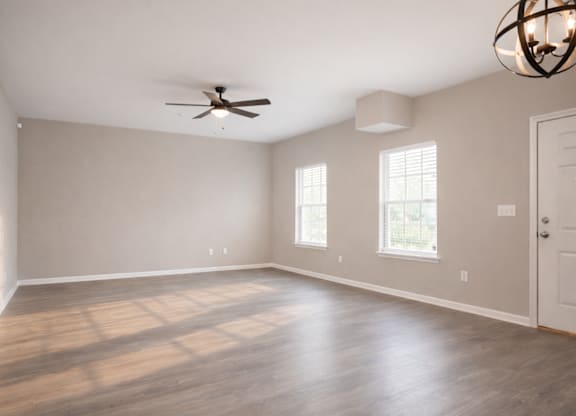 Room with windows and ceiling fan at Club Villas Apartments, Kathleen