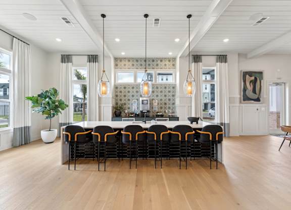 A large conference room with a long table and chairs at The Hendry Apartments, Fort Myers, 33905