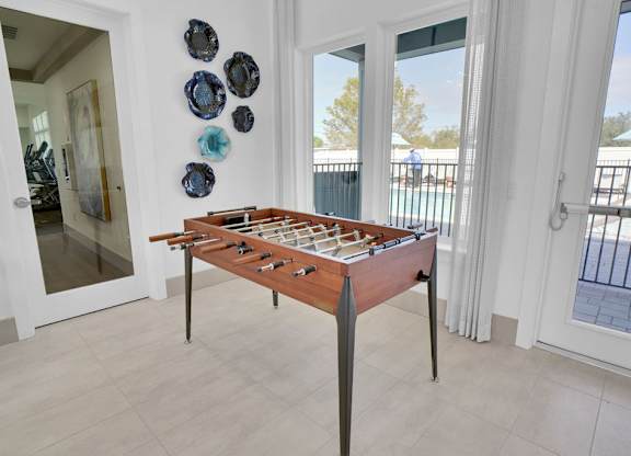 A shiny wooden table with a checkerboard pattern on it.
