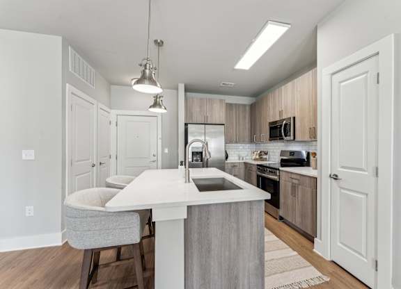 kitchen with island at The Hendry Apartments, Fort Myers, 33905
