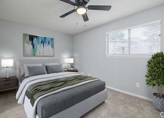 A Bedroom With Painting on the Wall at Avondale Place Apartments, Avondale Estates, GA, 30002