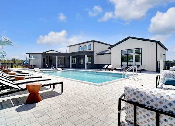 A modern house with a pool in the backyard.