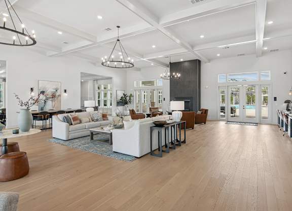 A spacious living room with a variety of furniture and decor at The Hendry Apartments, Fort Myers, FL, 33905