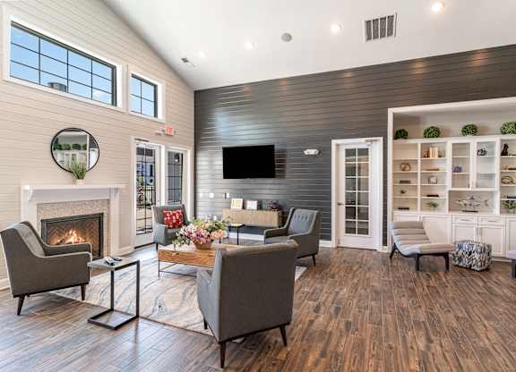 a living room with furniture and a fireplace
