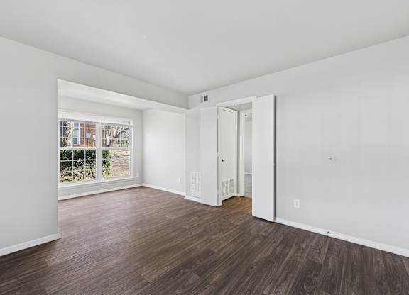 Room with white walls and window at Lexington on the Green, North Carolina