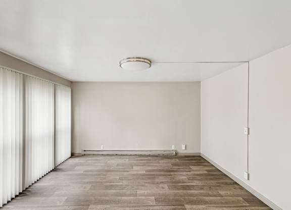 Room with wooden floor at Madison Flats, Madison