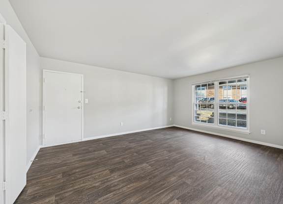 Room with wooden flooring and window at Lexington on the Green, Raleigh, NC