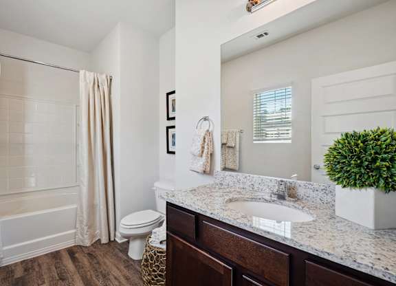 Bathroom with a sink and a toilet and a shower  at The Meadows, Bloomingdale, Georgia