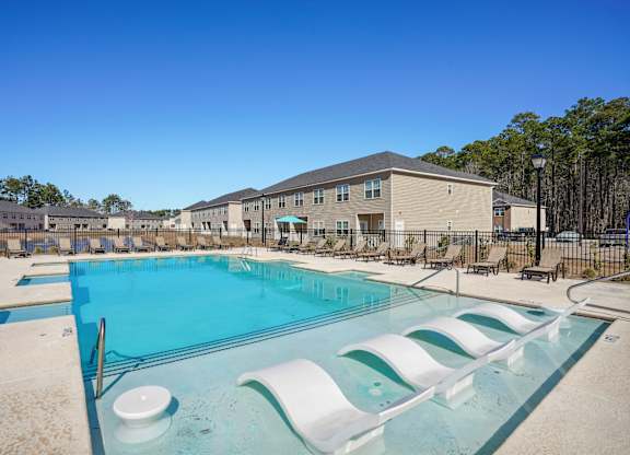 Resort style pool with lounge chairs  at The Meadows, Georgia