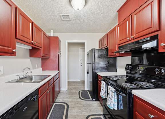 Kitchen with Red Cabinets at Casa de Luna Apartments, Raleigh, NC