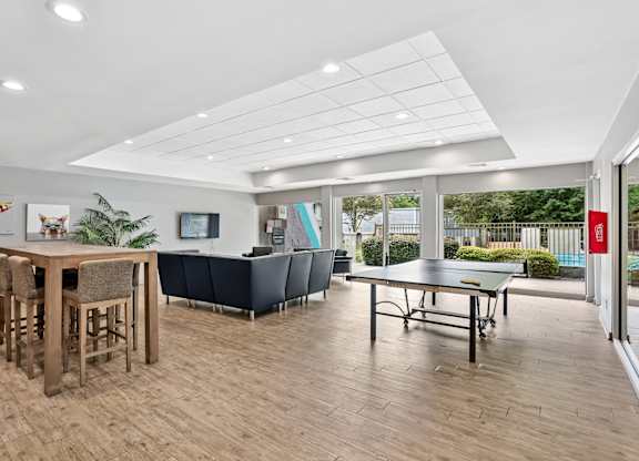 A room with a bar and a ping pong table.at Magnolia at Whitlock, Marietta Georgia