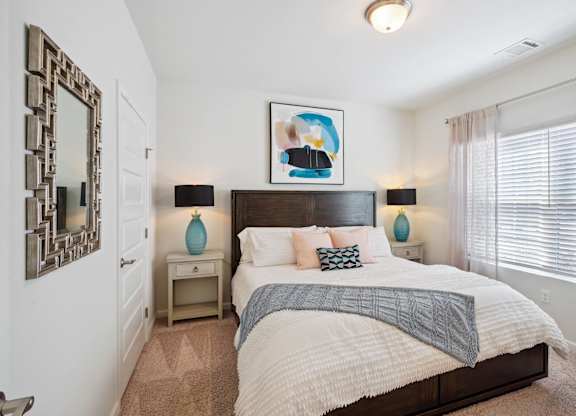 Bedroom with a large bed and a window  at The Meadows, Georgia, 31302