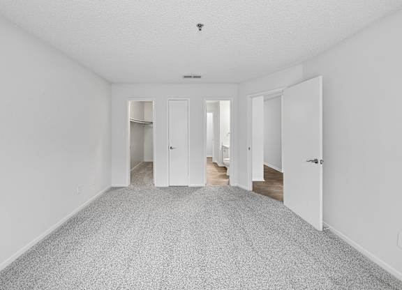 A long, empty hallway with doors on both sides.
