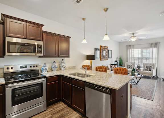 Kitchen with stainless steel appliances and a granite counter top