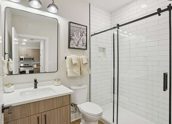 A bathroom with a white sink and toilet at Union Eleven Apartments, Atlanta, GA