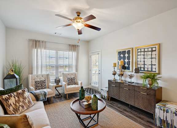 Living room with furniture and a ceiling fan  at The Meadows, Bloomingdale, GA