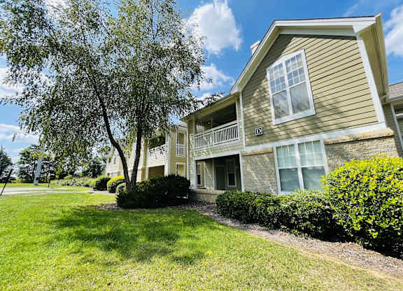 House with a lawn and trees in front of it at The Chase, North Carolina