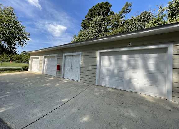 Garage with two garage doors on the side of a house t The Chase, Burlington, NC 27215
