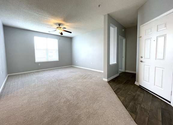 Living room with a ceiling fan at The Chase, Burlington, NC 27215