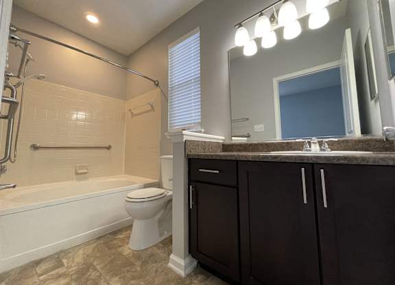 Bathroom with a sink and a toilet and a bath tub at The Chase, North Carolina, 27215