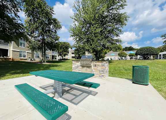 Picnic area with a picnic table and a fire pit at The Chase, Burlington North Carolina