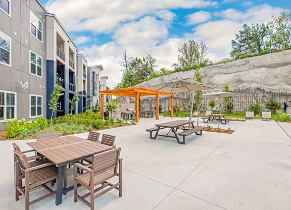 A patio with a table and chairs and a pavilion at The Percy Apartments, Nashville, Tennessee
