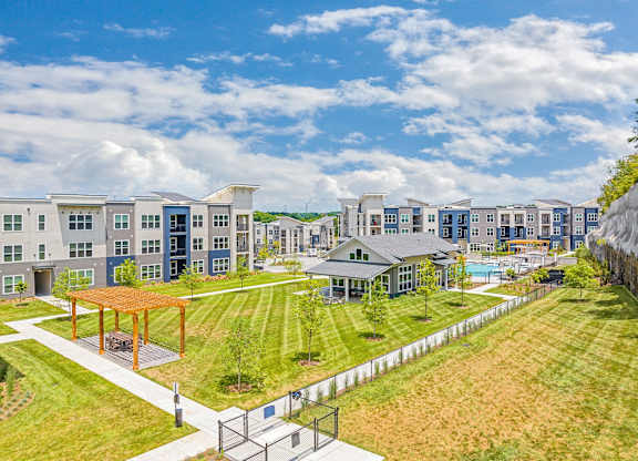 A large building complex with a playground in the foreground at The Percy Apartments, Nashville, 37214