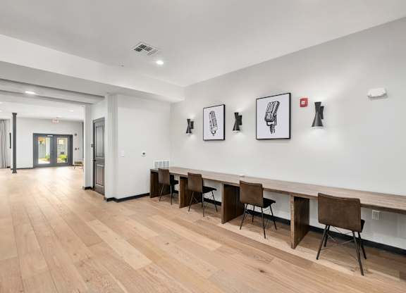 A room with a long table and chairs at The Percy Apartments, Nashville, TN, 37214