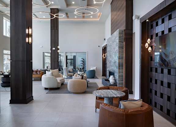 A modern living room with a black and white color scheme at The Waverly at Winter Haven Apartments, Winter Haven, FL, 33884