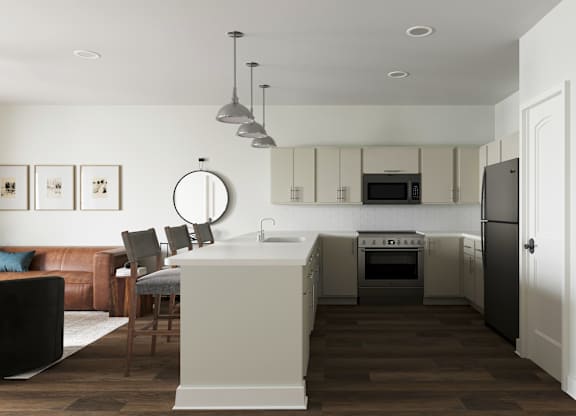 A modern kitchen with a brown wooden floor and white walls at The SoHo Luxury Apartments, Raleigh