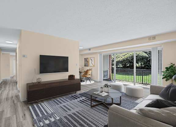 A living room with a television, a couch, and a coffee table.