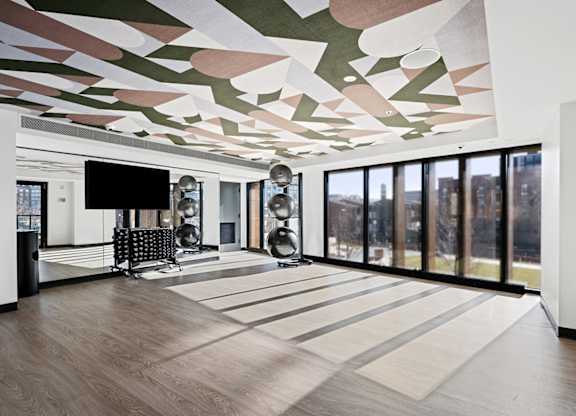 A modern room with a TV and a chair.