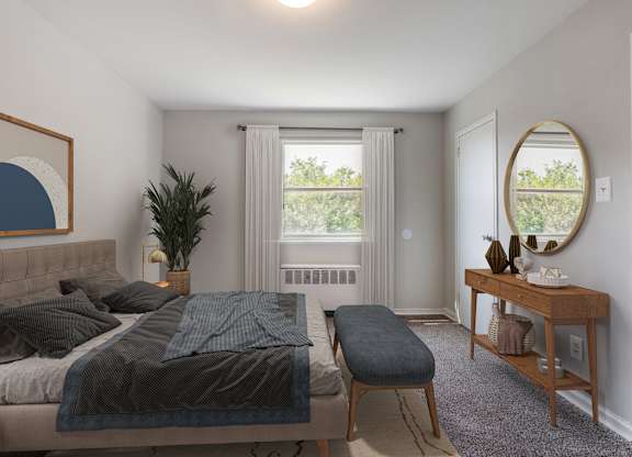 A bedroom with a bed, a bench, and a mirror.