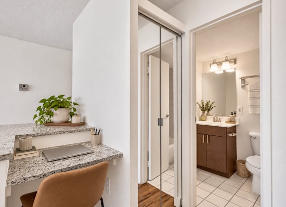 A bathroom with a sink and a mirror.