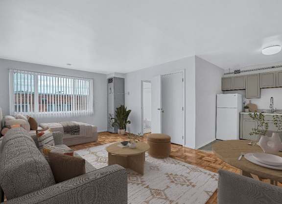A modern living room with a grey couch and a wooden coffee table.