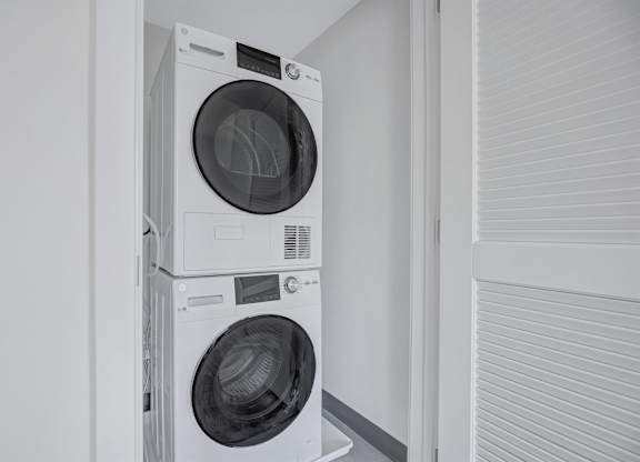 Two washing machines stacked on top of each other.