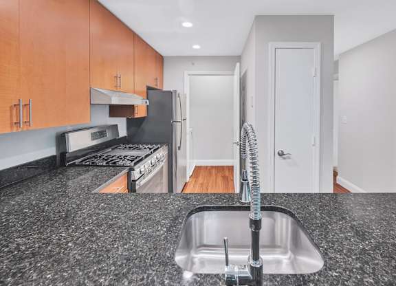 a kitchen with granite counter tops and a sink