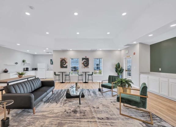 a living room filled with furniture and a large window