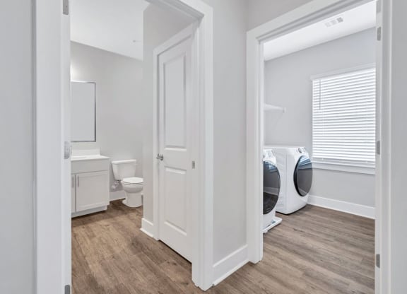 The bathroom and laundry room in the Sandstone floor plan at Overlook at Riverside.