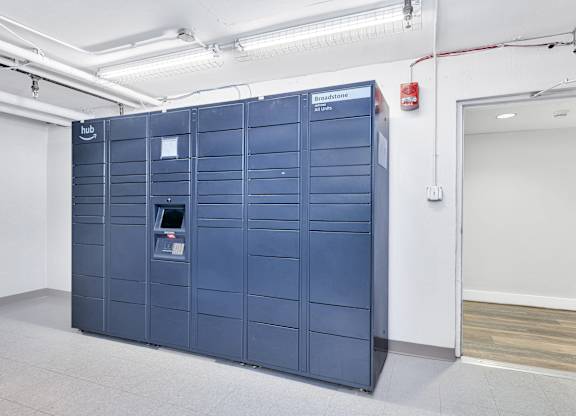a set of blue lockers in a room with a door