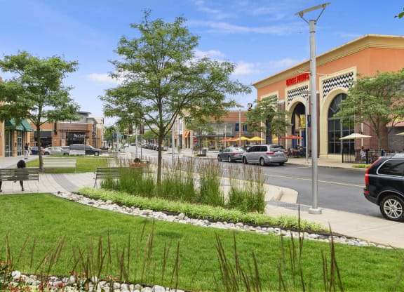a rendering of a park in front of a shopping center