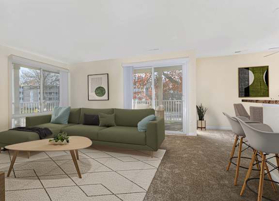A living room with a green couch and a coffee table.