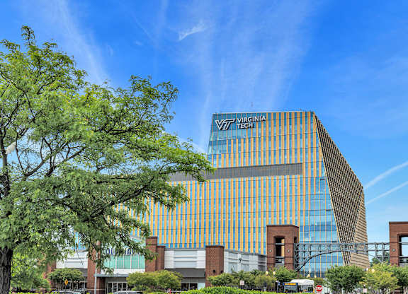 A modern building with a glass facade and the words