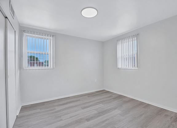 A room with a window and a door.