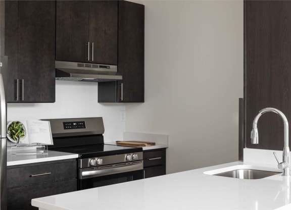 a kitchen with a sink and a stove
